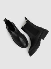 Women Leather Cleated Sole Chelsea Boots in Black