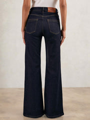 Women Petite Mid-Rise Flared Jeans in Dark Blue