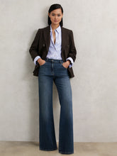 Women Petite Mid-Rise Flared Jeans in Mid Blue