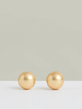 Women Polished Ball Huggie Earrings in Gold