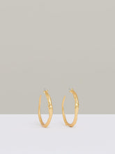 Women Molten Hoop Earrings in Gold Tone