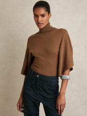 Women Merino Wool Batwing Roll-Neck Jumper in Tan
