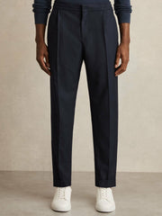 Men Relaxed-Fit Pleated Tapered Trousers in Navy