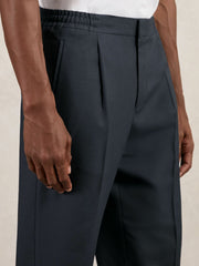 Men Relaxed-Fit Pleated Tapered Trousers in Steel Blue