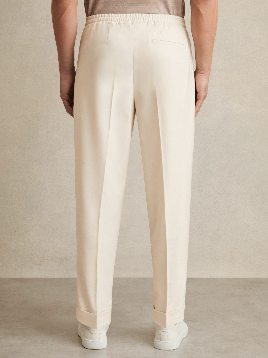 Men Relaxed-Fit Pleated Tapered Trousers in Ecru