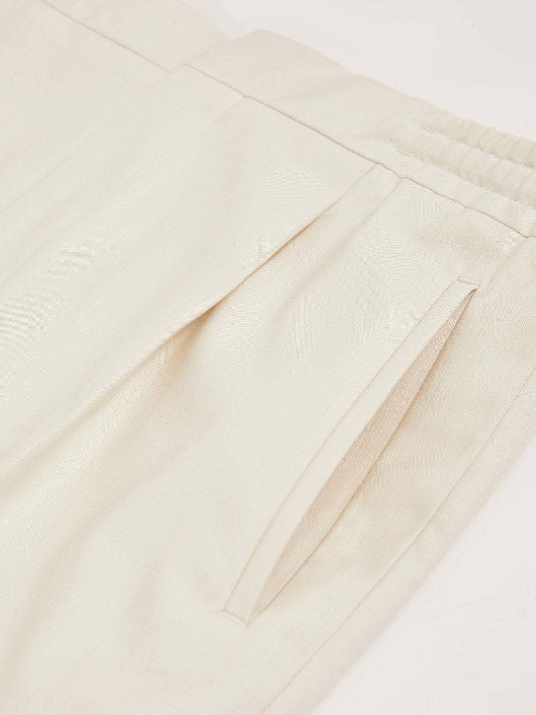 Men Relaxed-Fit Pleated Tapered Trousers in Ecru