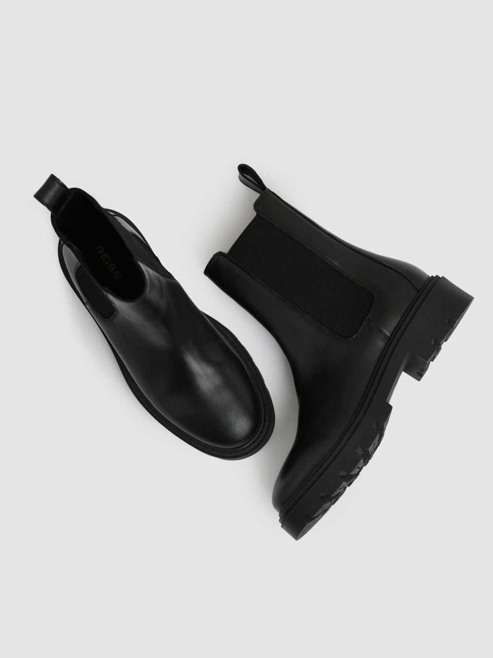 Women Leather Cleated Sole Chelsea Boots in Black