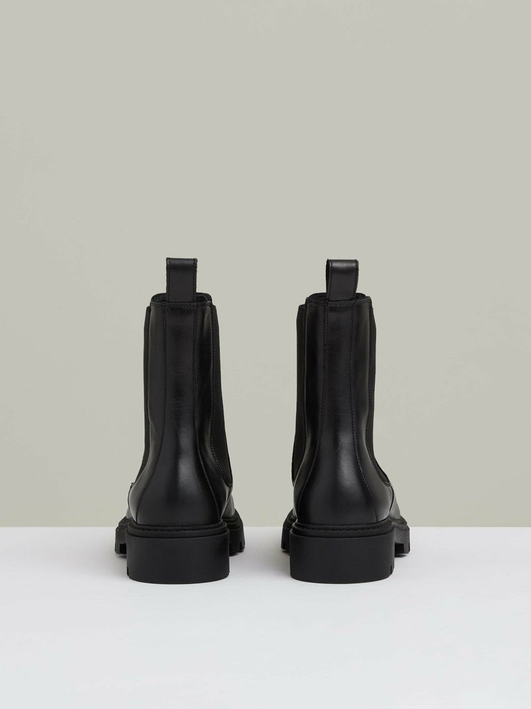 Women Leather Cleated Sole Chelsea Boots in Black