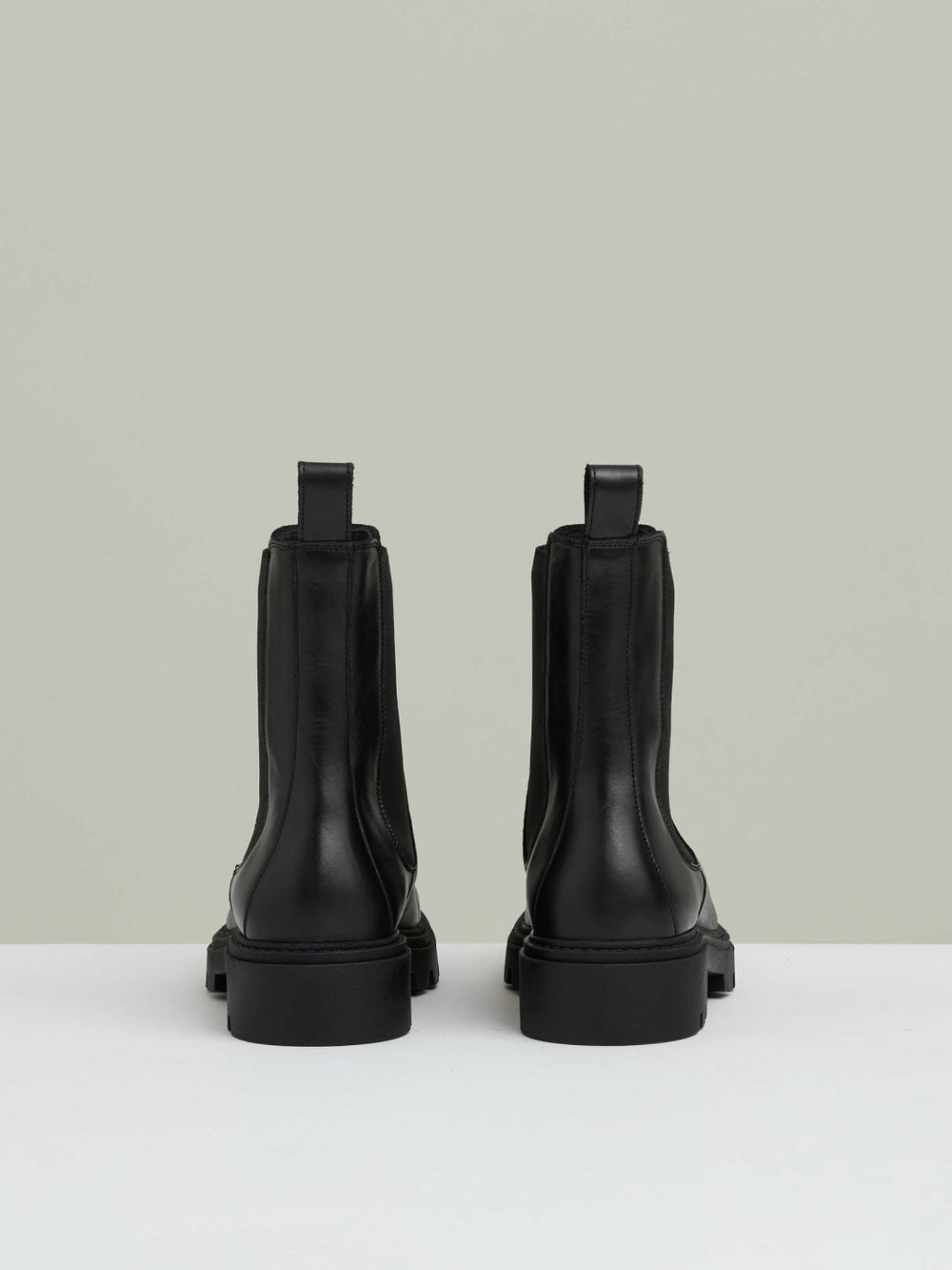 Women Leather Cleated Sole Chelsea Boots in Black