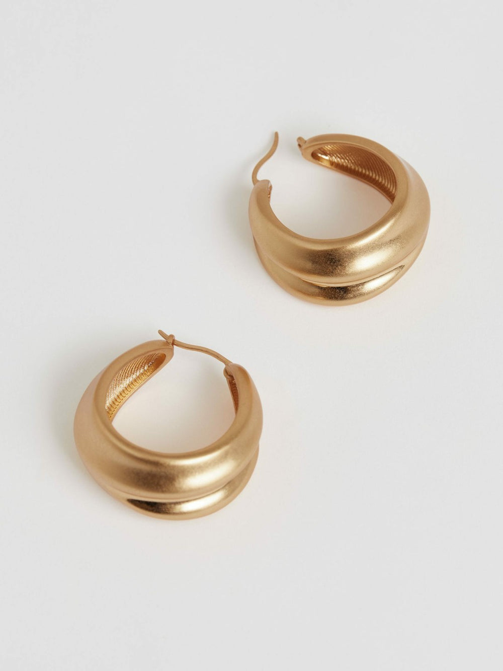 Women Sculptural Hoop Earrings in Gold Tone
