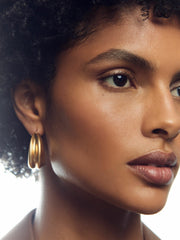 Women Sculptural Hoop Earrings in Gold Tone
