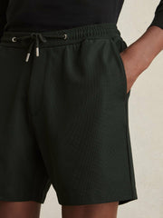 Men Textured Drawstring Shorts in Dark Green