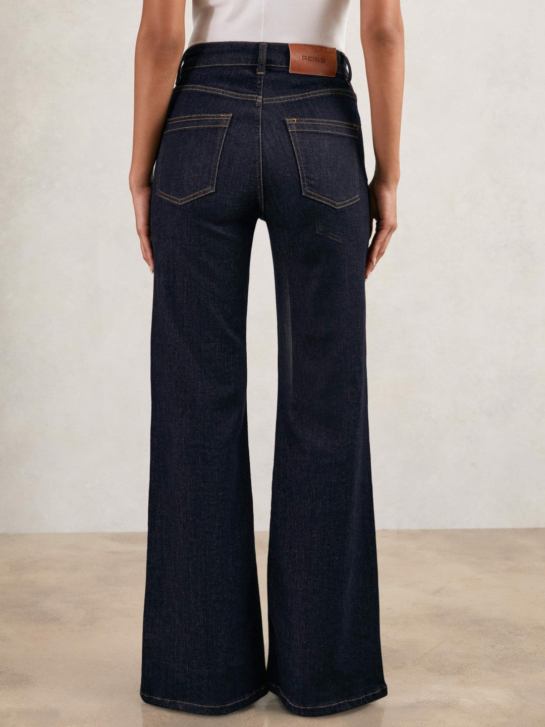 Women Petite Mid-Rise Flared Jeans in Dark Blue