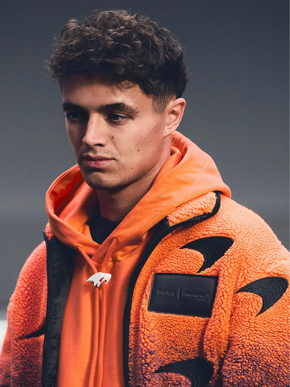 Men Unisex Fit McLaren F1 Team Ombré Fleece Jacket in Papaya Orange/Purple