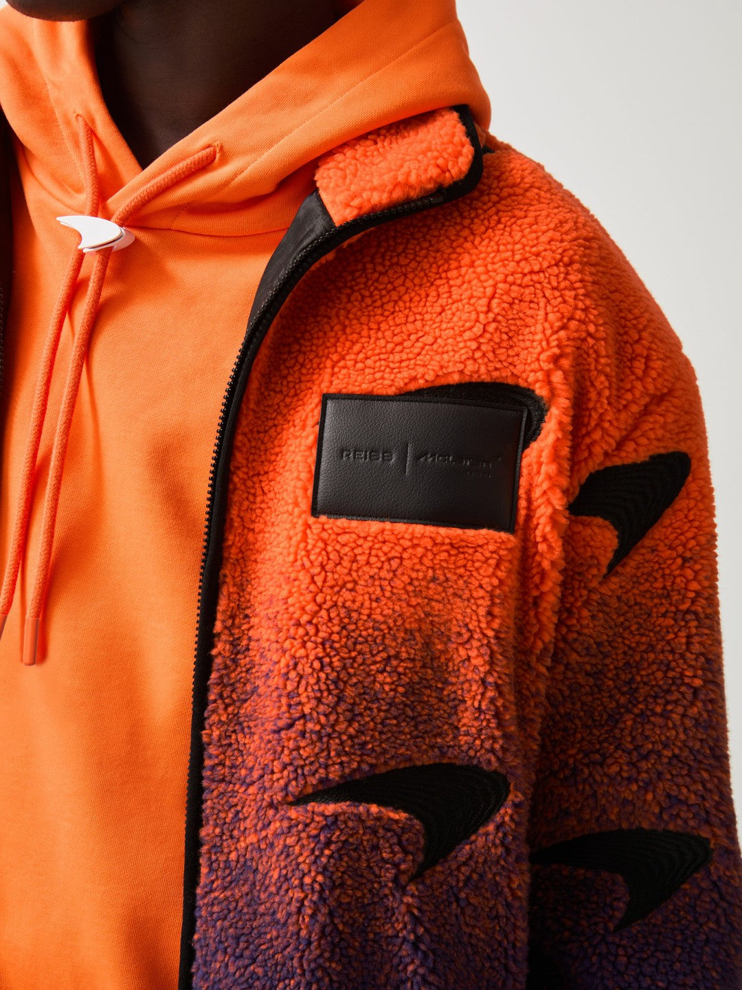 Men Unisex Fit McLaren F1 Team Ombré Fleece Jacket in Papaya Orange/Purple