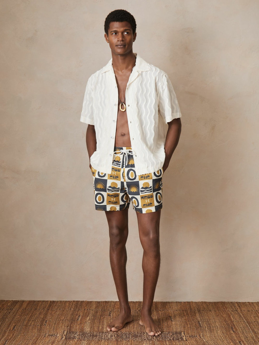 Men | Ché Sunset-Print Swim Shorts in Olive Green