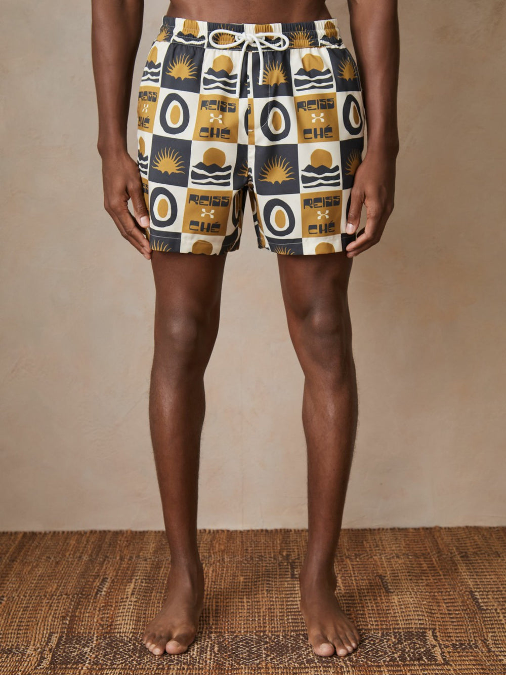 Men | Ché Sunset-Print Swim Shorts in Olive Green
