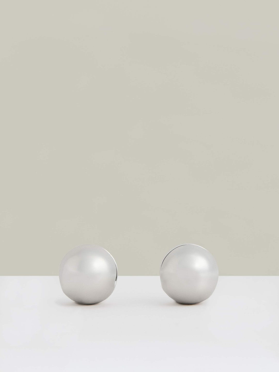 Women Polished Ball Huggie Earrings in Silver Tone