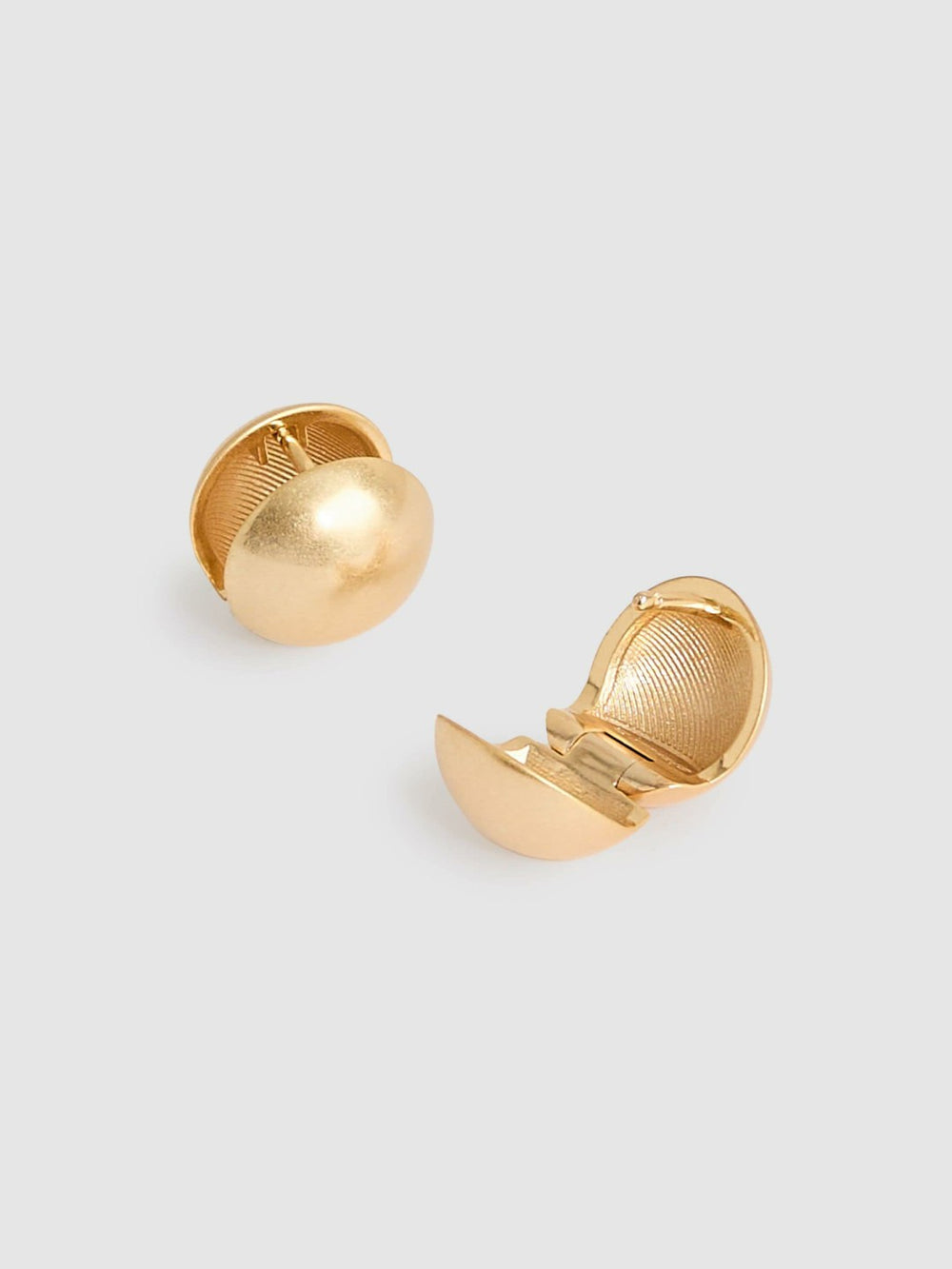 Women Polished Ball Huggie Earrings in Gold