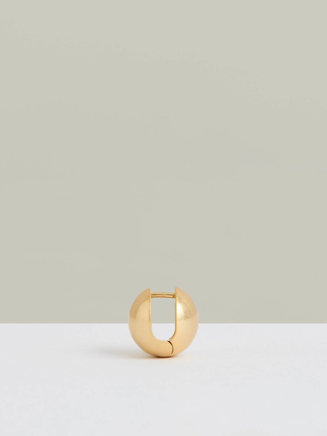Women Polished Ball Huggie Earrings in Gold
