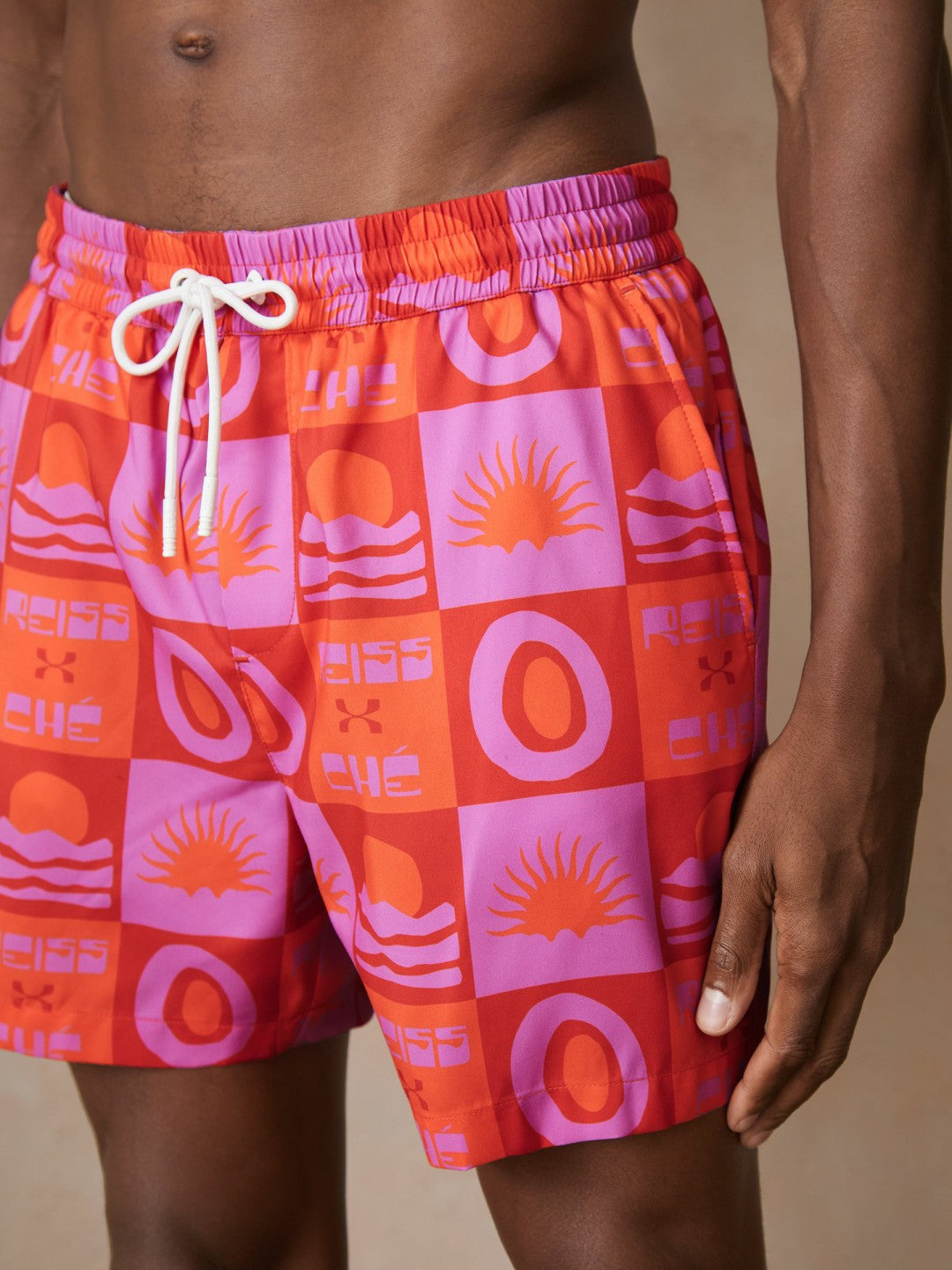Men | Ché Sunset-Print Swim Shorts in Orange/Pink