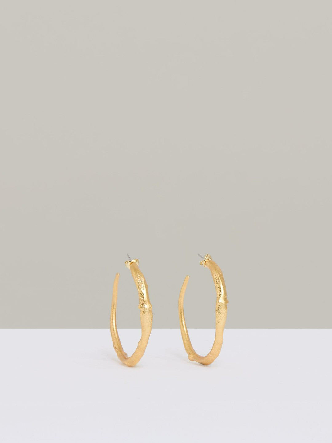 Women Molten Hoop Earrings in Gold Tone