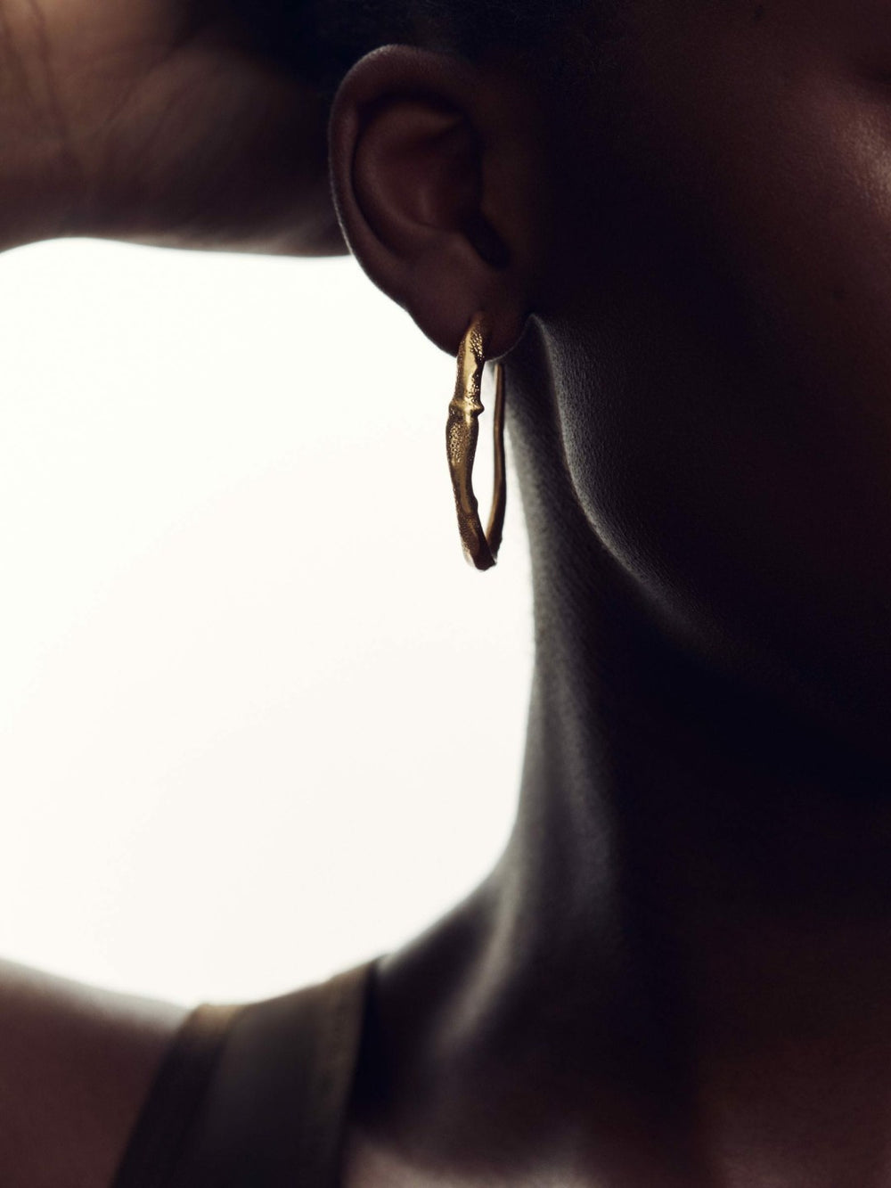 Women Molten Hoop Earrings in Gold Tone
