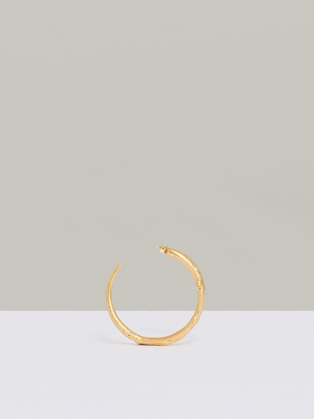 Women Molten Hoop Earrings in Gold Tone