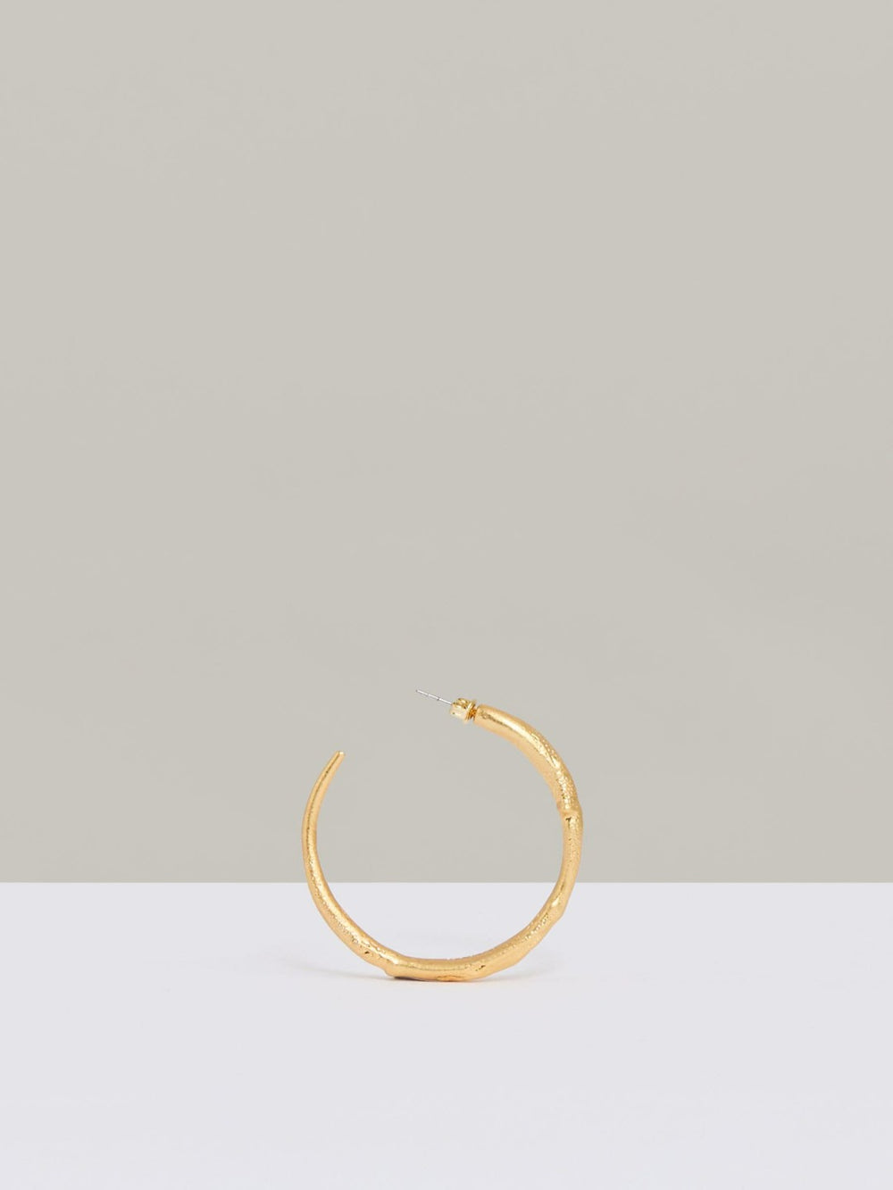 Women Molten Hoop Earrings in Gold Tone