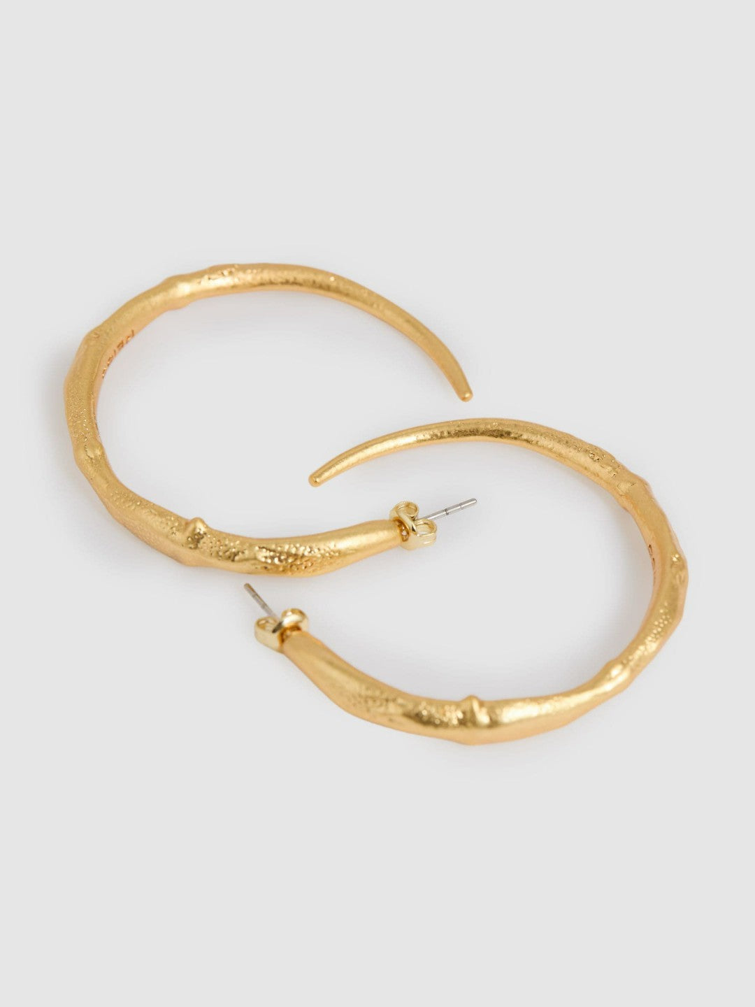 Women Molten Hoop Earrings in Gold Tone