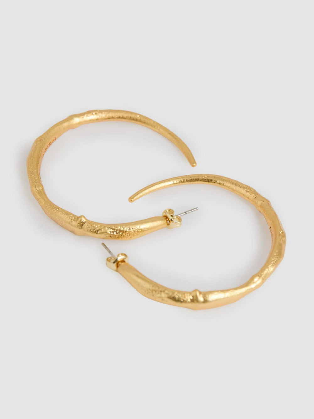 Women Molten Hoop Earrings in Gold Tone