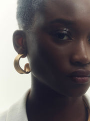 Women Fluid Hoop Earrings in Gold Tone