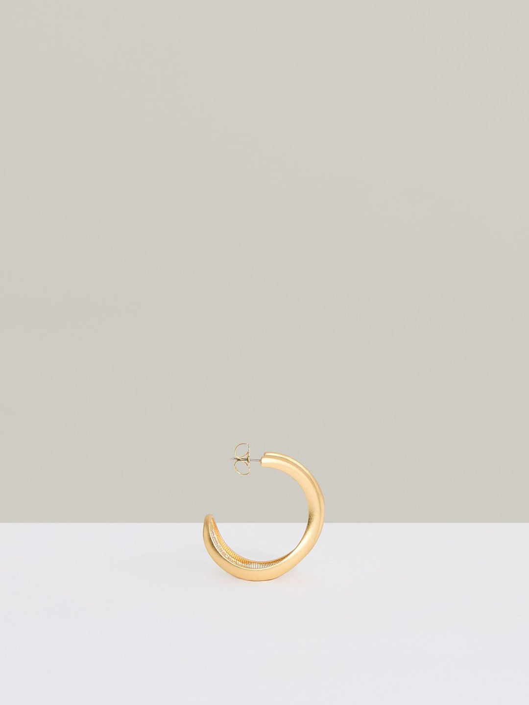 Women Fluid Hoop Earrings in Gold Tone