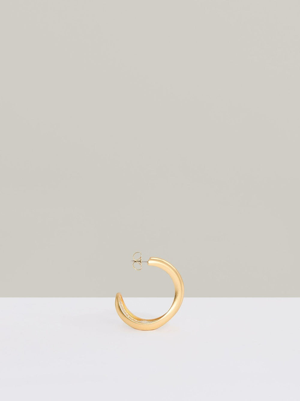 Women Fluid Hoop Earrings in Gold Tone