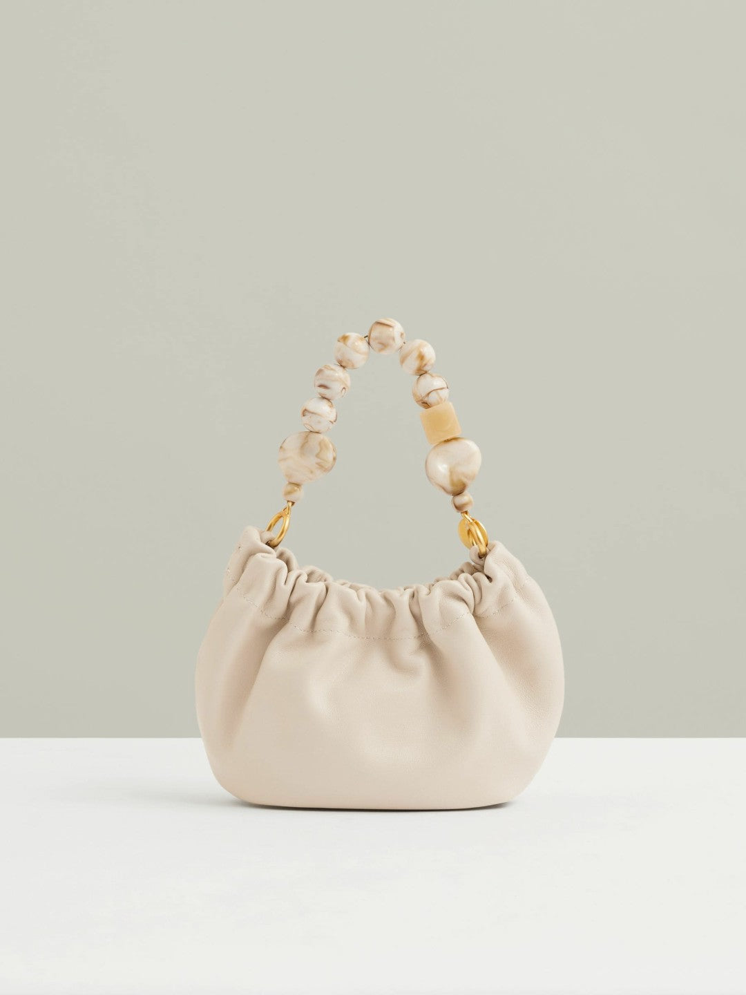 Women Leather Bead-Handle Pouch Bag in Off White