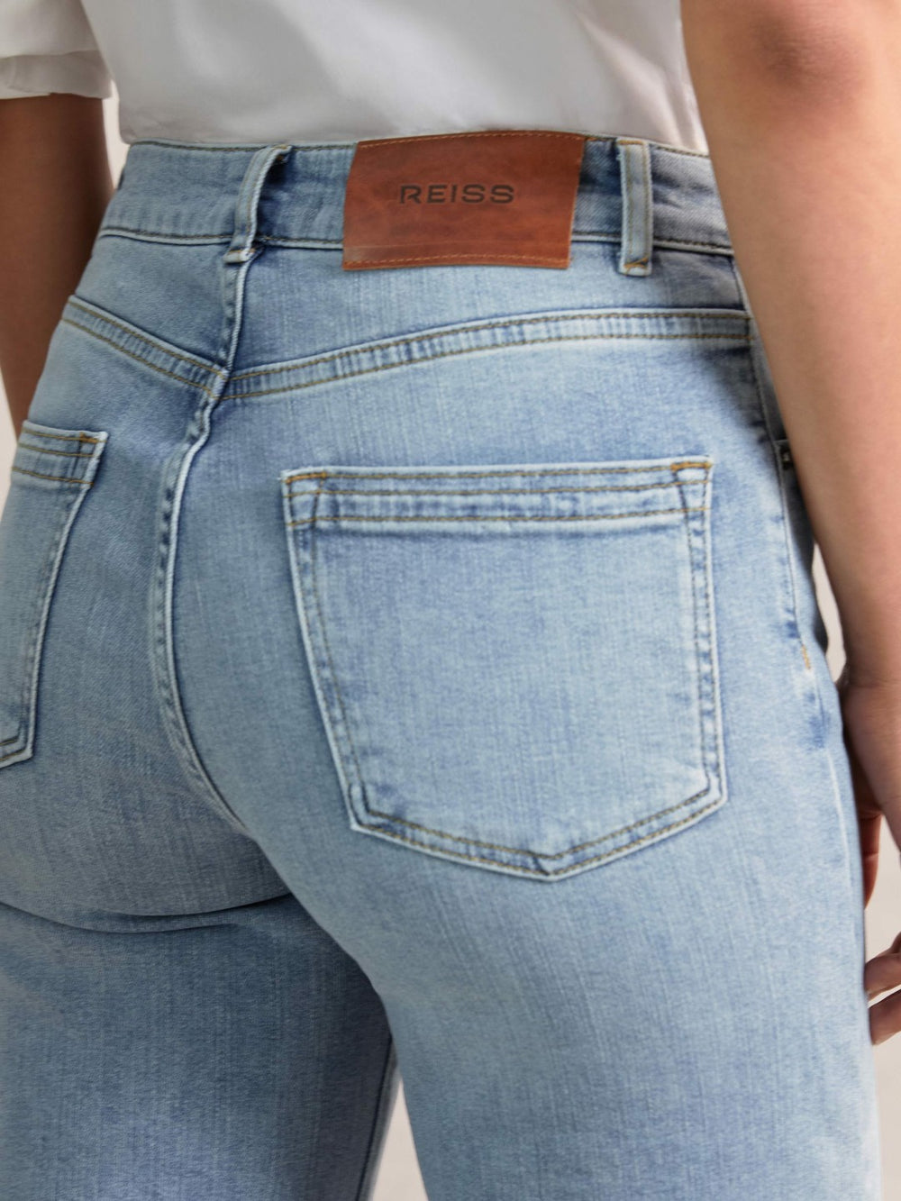 Women Petite Mid-Rise Flared Jeans in Light Blue