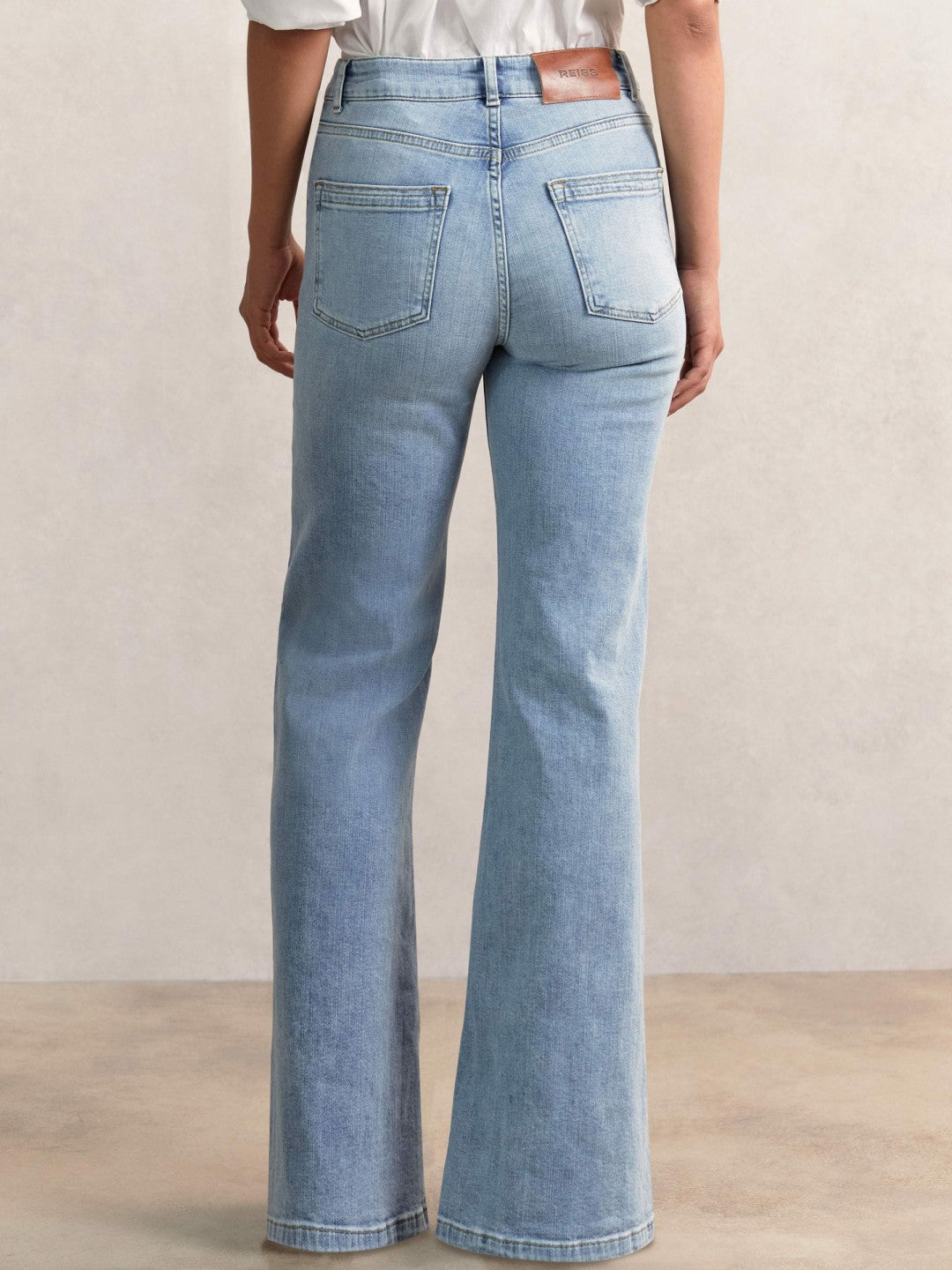 Women Petite Mid-Rise Flared Jeans in Light Blue