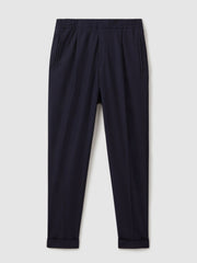 Men Relaxed-Fit Pleated Tapered Trousers in Navy