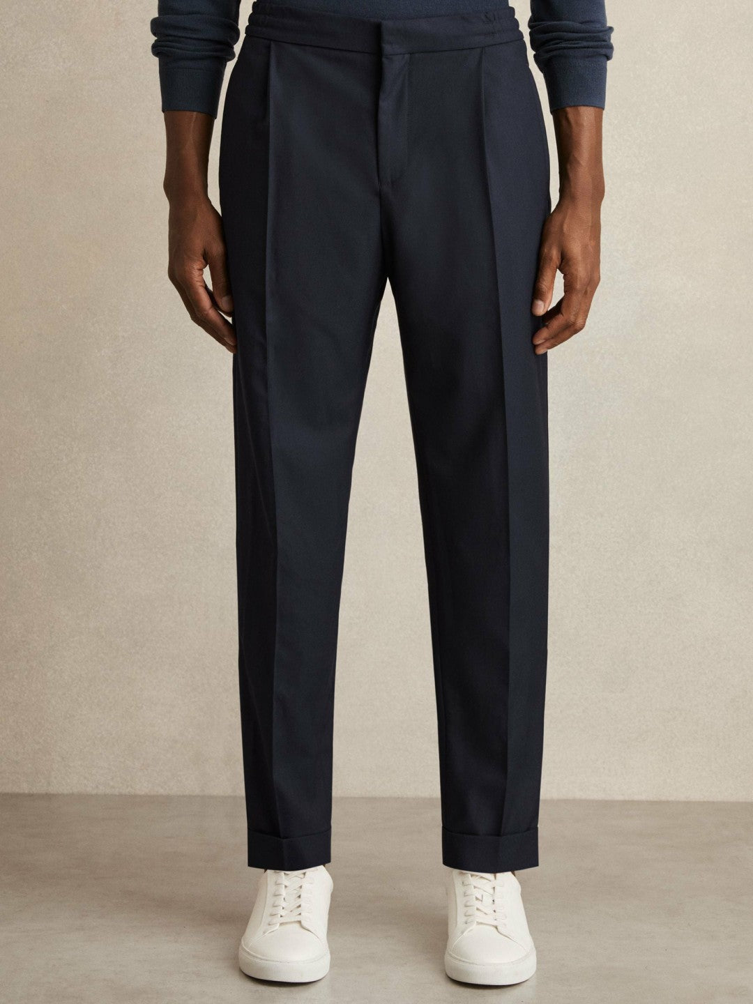 Men Relaxed-Fit Pleated Tapered Trousers in Navy