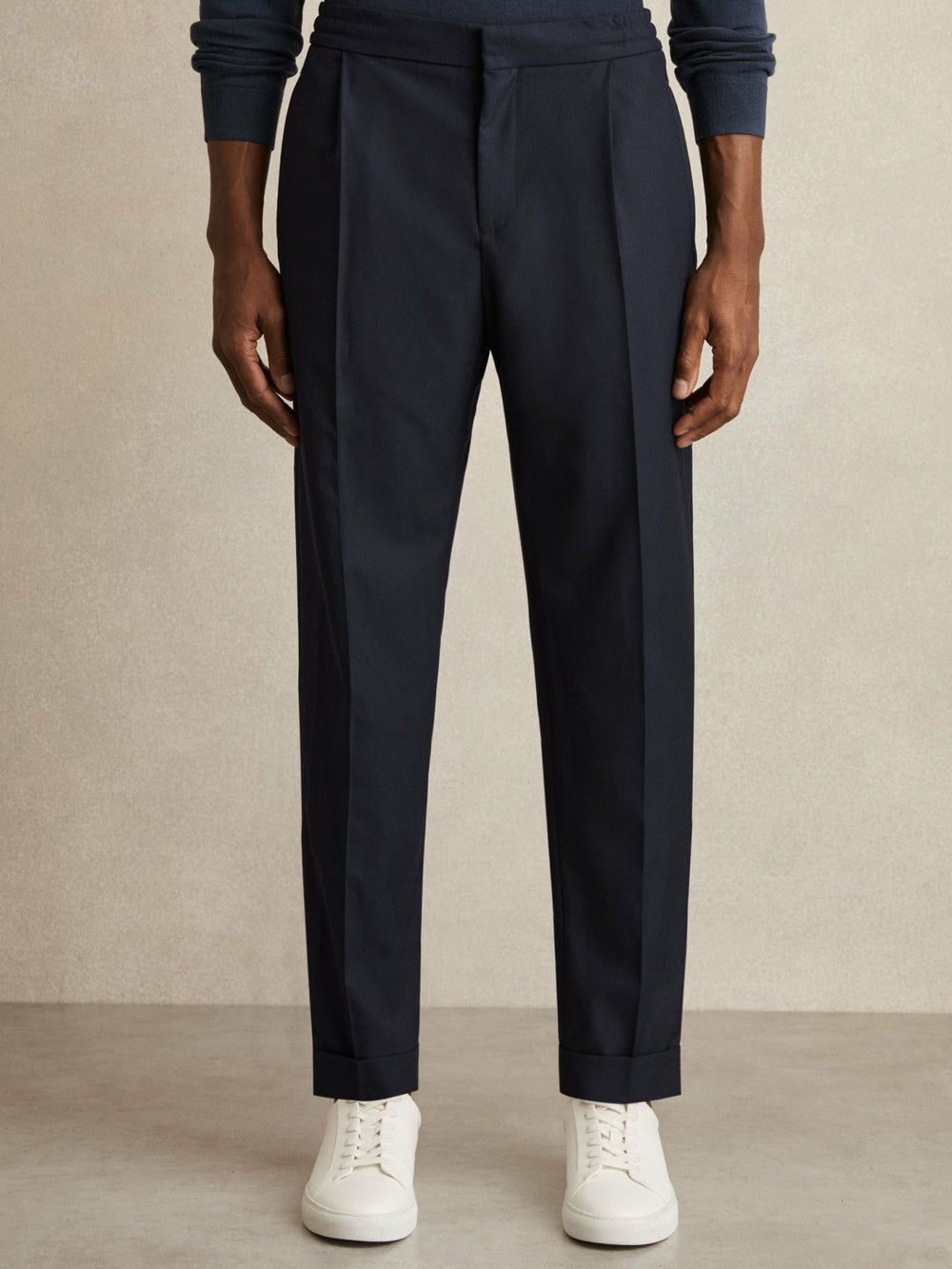 Men Relaxed-Fit Pleated Tapered Trousers in Navy