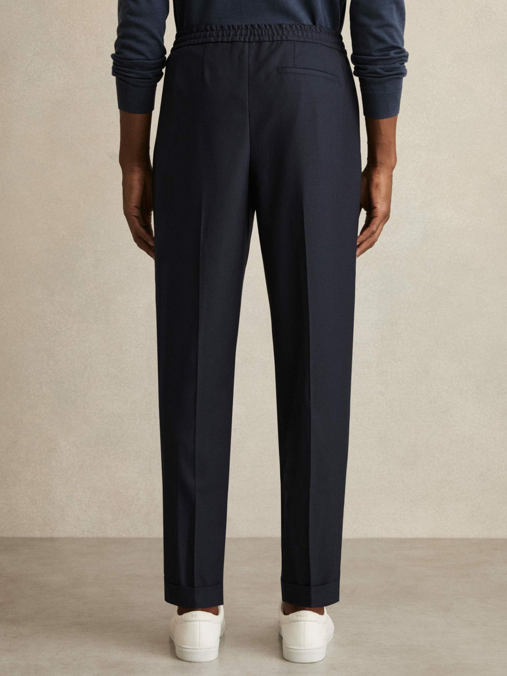 Men Relaxed-Fit Pleated Tapered Trousers in Navy