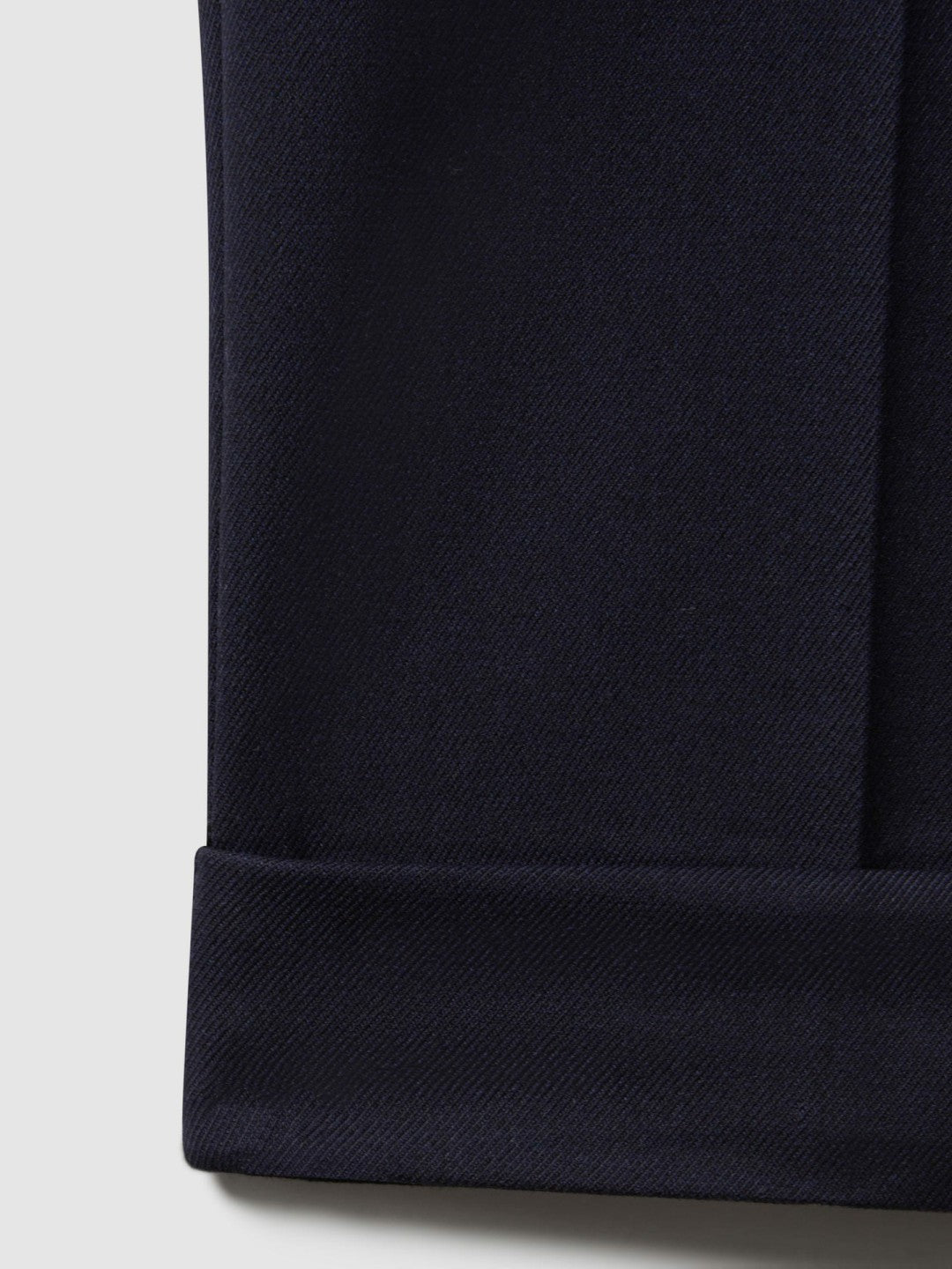 Men Relaxed-Fit Pleated Tapered Trousers in Navy