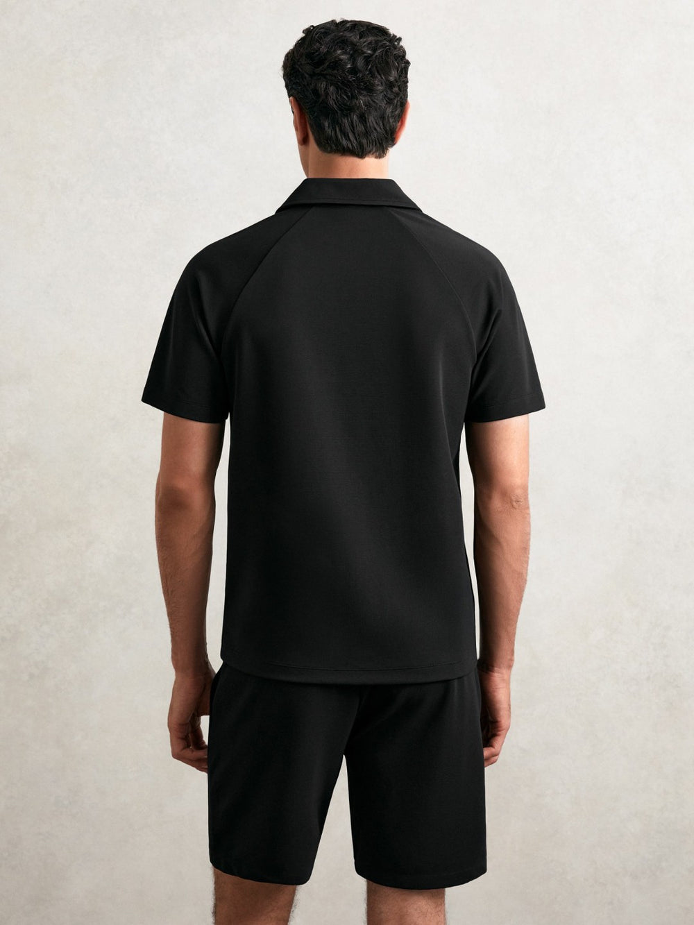 Men Textured Raglan Half-Zip Polo Shirt in Black